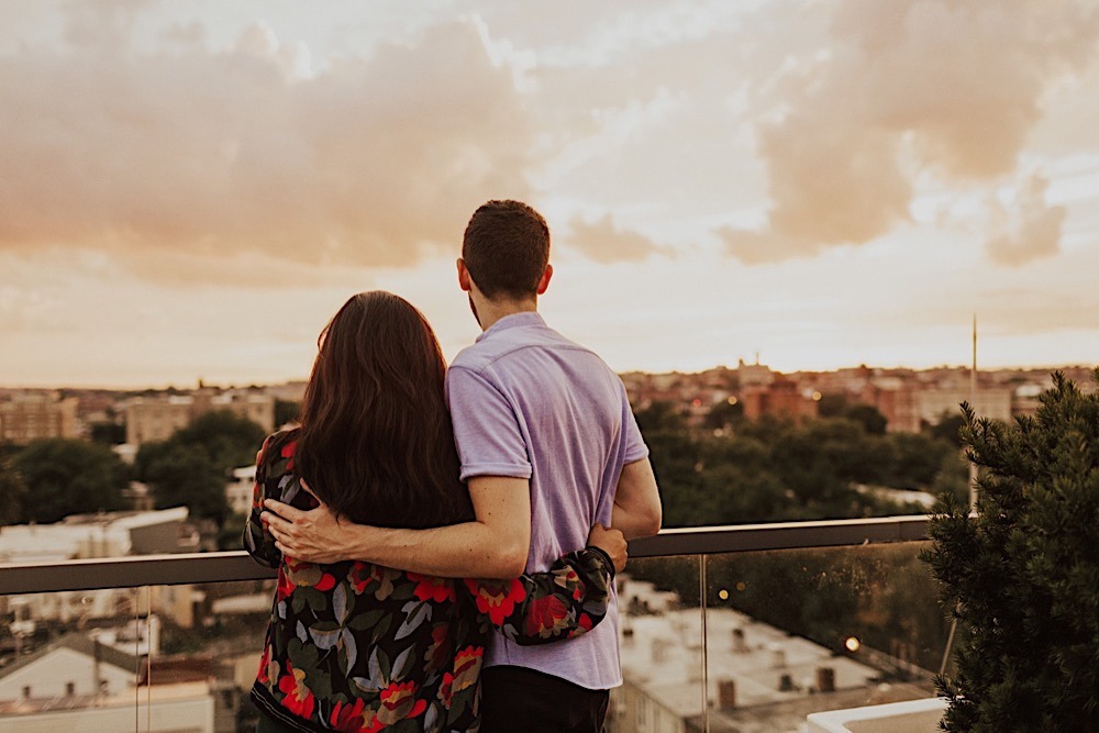 Couple overlooks Adams Morgan Washington DC during sunset