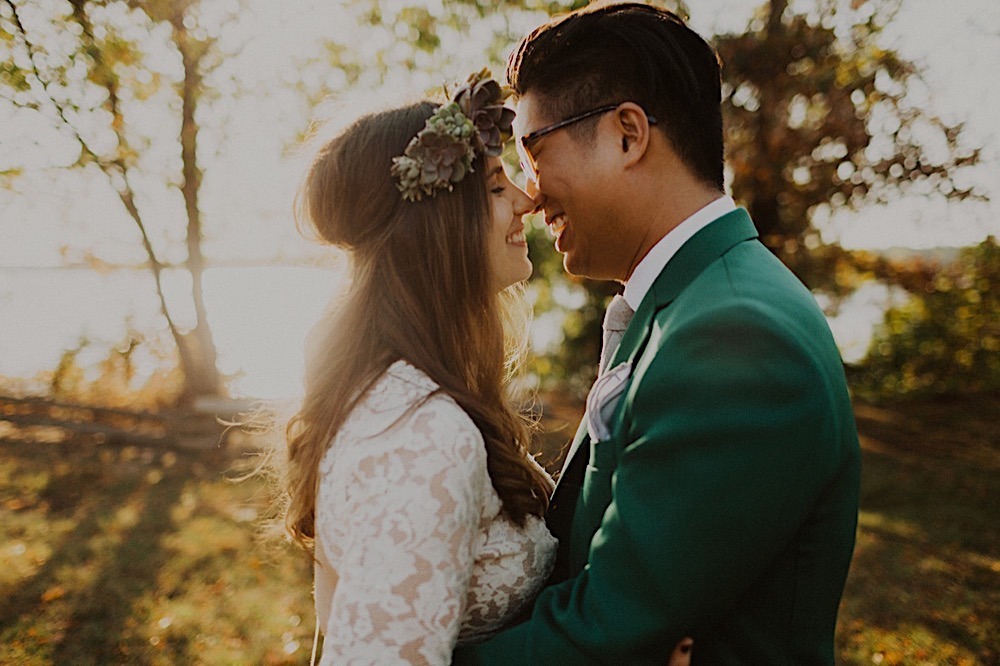 bride with succulent crown closes in for kiss in sunset